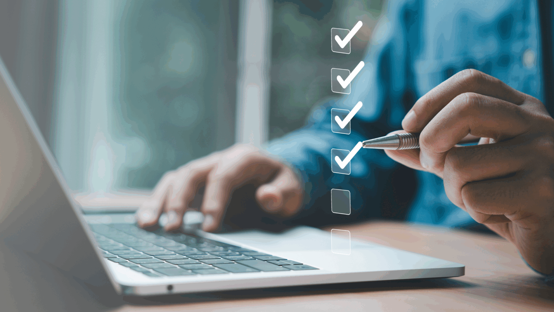 Business professional completing a digital checklist beside a laptop